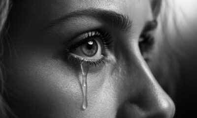 does crying make your eyelashes Longer? - Close-up of a teary eye with long eyelashes