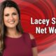 Lacey Swope Net Worth 2025 – News 9 meteorologist smiling in studio with red background, representing her career, success, and biography.